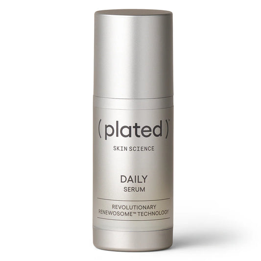 Silver skincare serum bottle labeled 'plated' on a white background