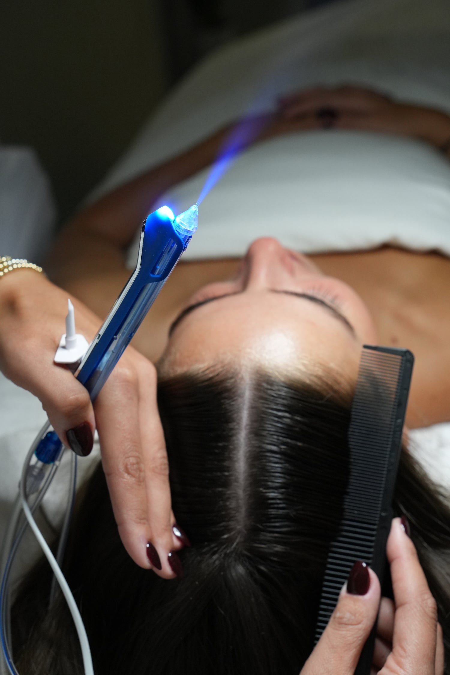 woman receiving jetpeel scalp treatment from MDR Skin Studio
